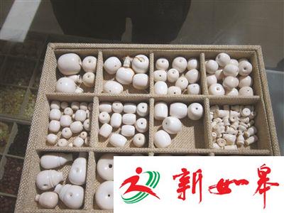 手串配饰竟是象牙制品 南京一文玩店老板被拘-雉水网