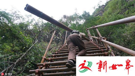 凉山悬崖村绝壁修路：背1500根钢管造天梯-雉水网
